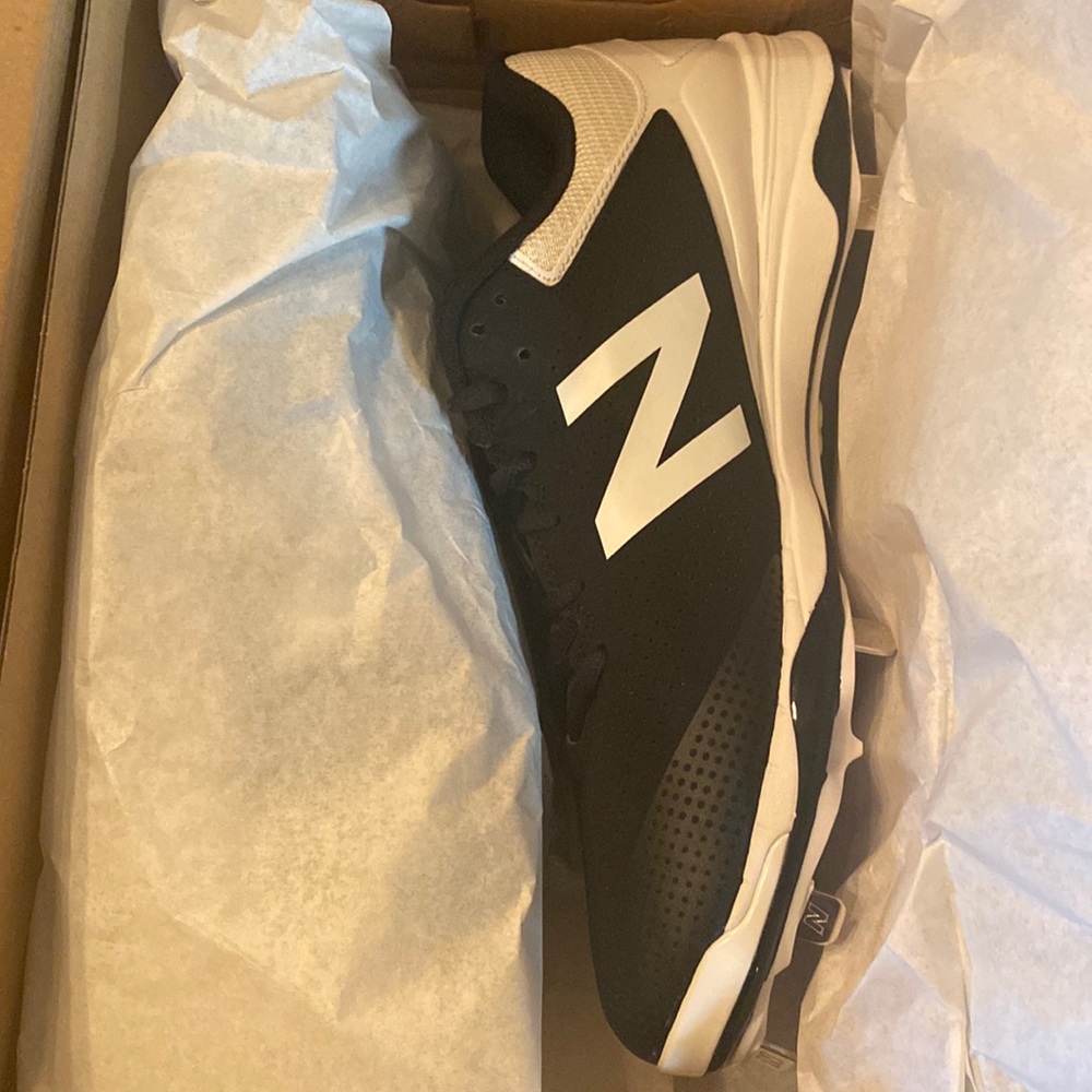 Brand new in the box metal softball cleats